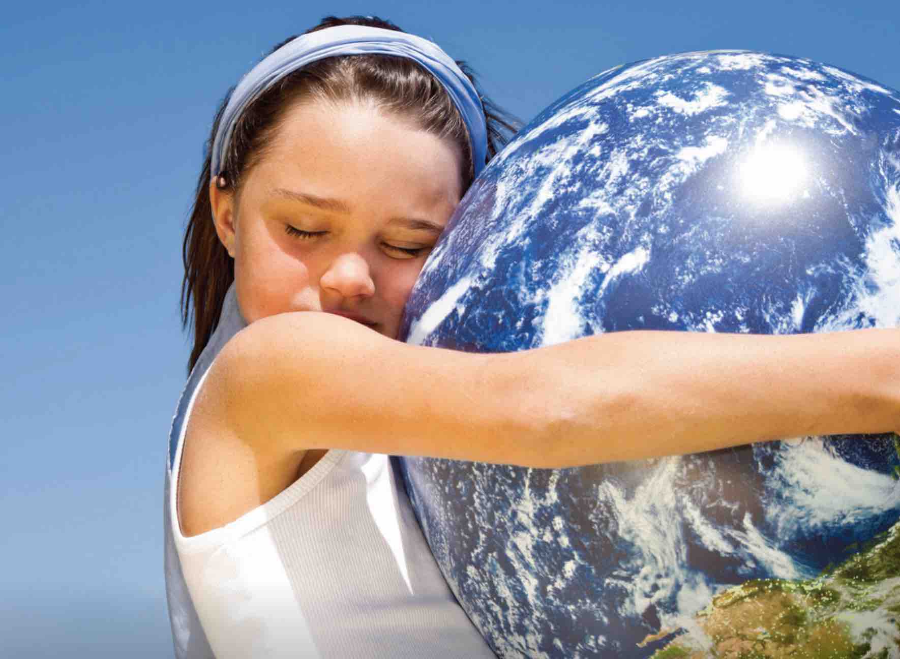 image of a girl hugging the planet